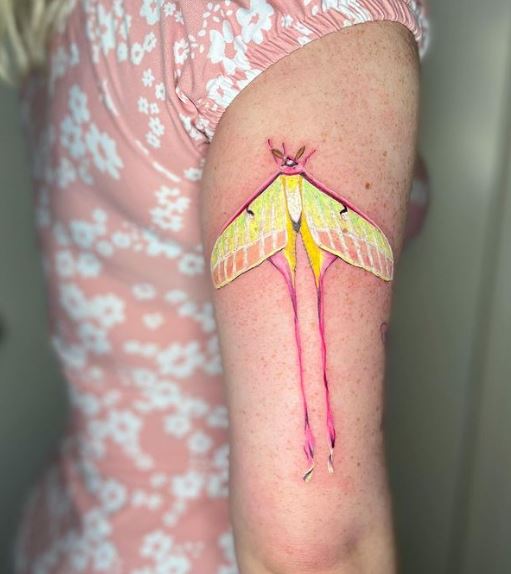 Yellow and Pink Moth Arm Tattoo