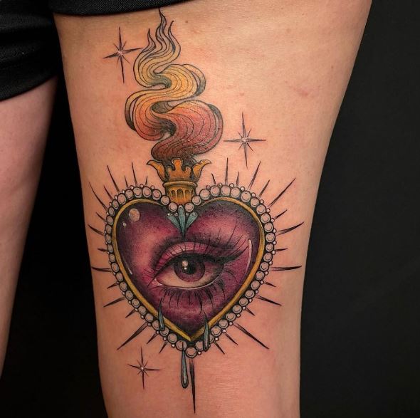 Realistic Crying Eye in Sacred Heart Thigh Tattoo