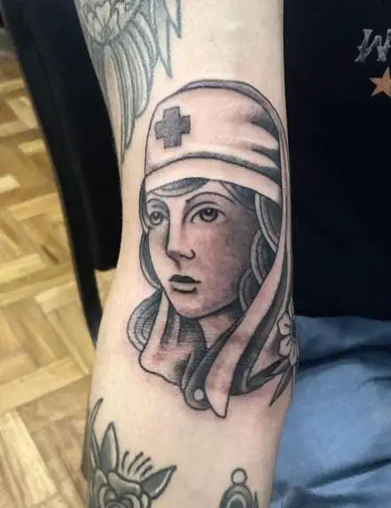 Shaded Grey Nurse Tattoo on Biceps