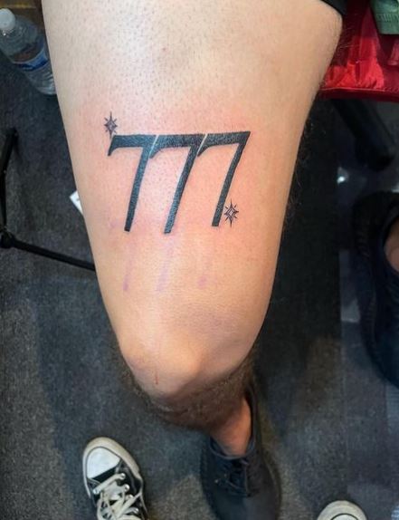 Stars and 777 Thigh Tattoo