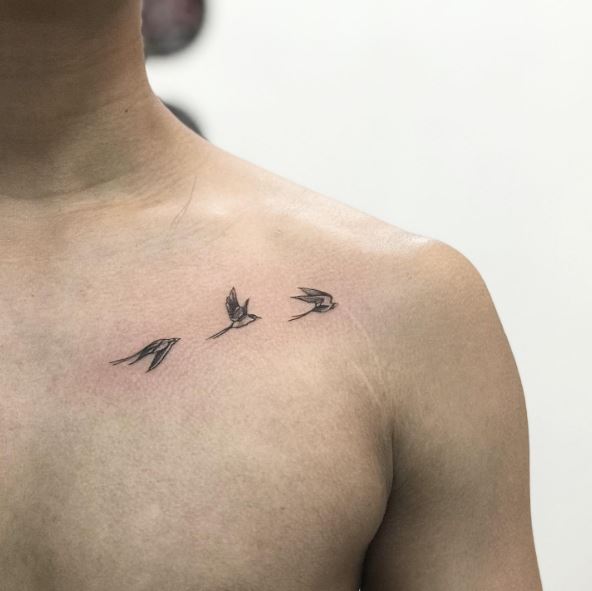 Family of Small Flying Swallows Chest Tattoo