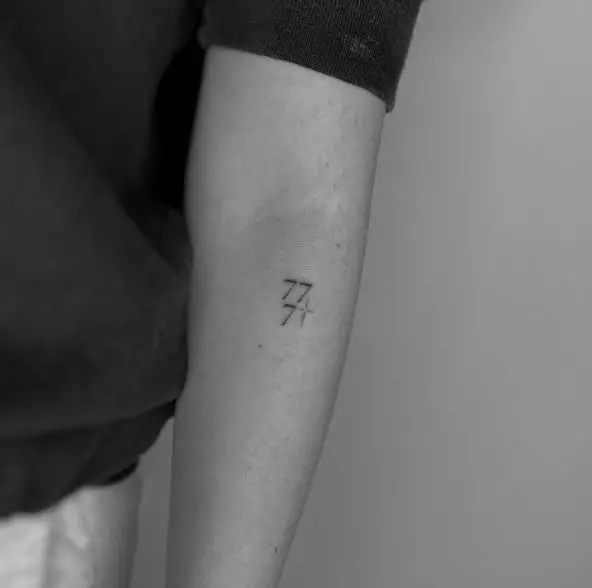 Minimalistic Star and 777 Forearm Tattoo