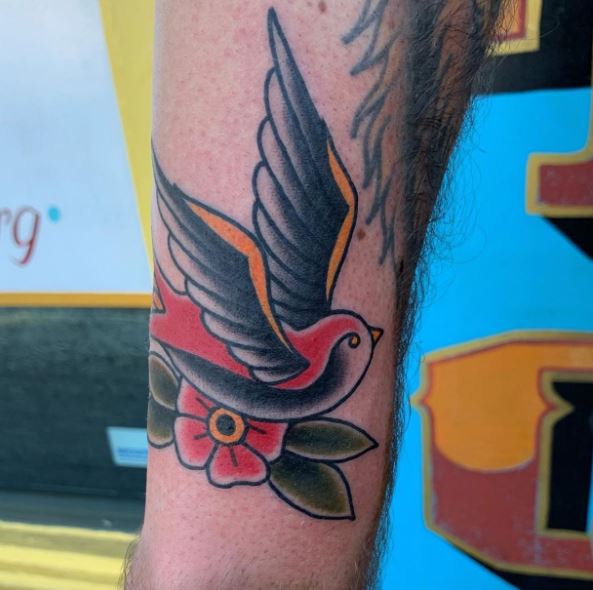 Colorful Swallow Flying over Flower Leg Tattoo