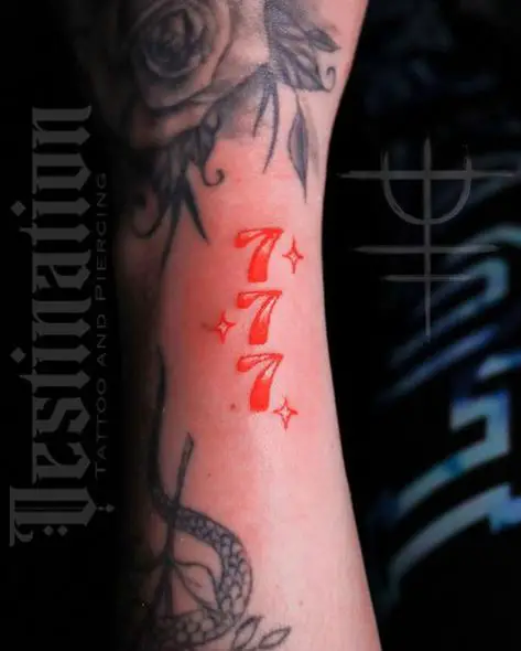 Red Stars and 777 Arm Tattoo