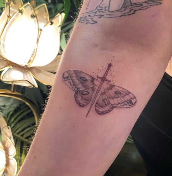 Grey Sward over Moth Forearm Tattoo