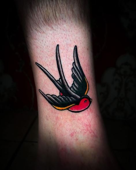 Black and Red Flying Swallow Tattoo