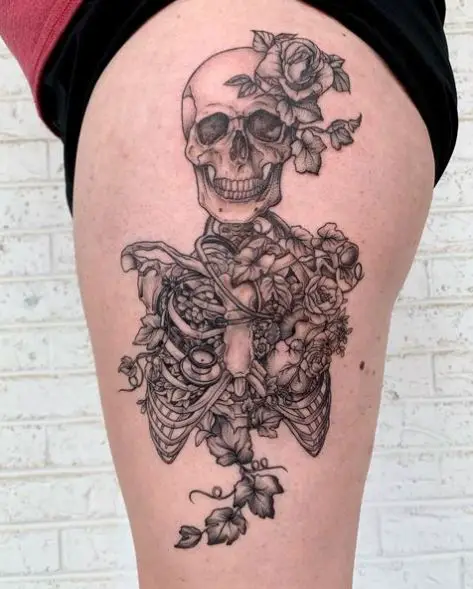 Partial Skeleton Encompassed by Vines and Flowers Tattoo