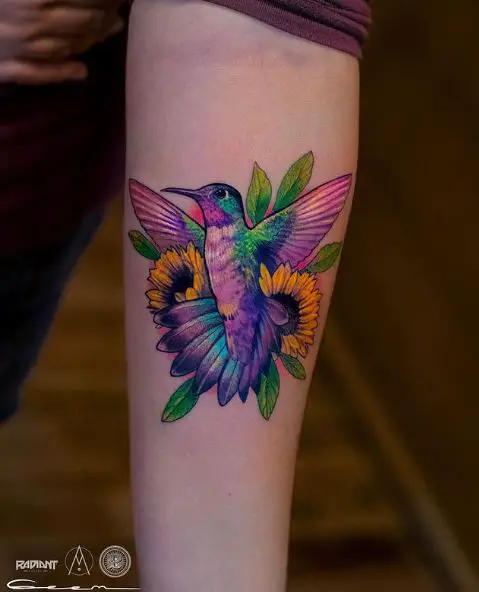 Vibrant Colored Hummingbird Tattoo below Elbow
