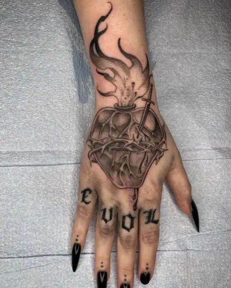 Grey Stabbed Sacred Heart Hand Tattoo