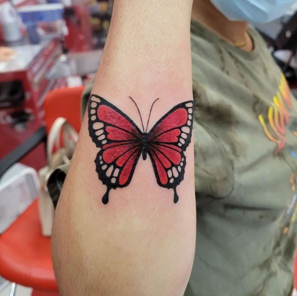 Realistic Black and Red Butterfly Forearm Tattoo