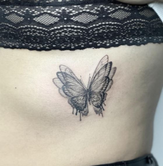 Blurry Butterfly Ribs Tattoo