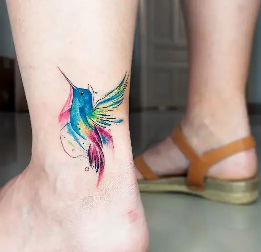 Vibrant Colored Hummingbird Tattoo on Ankle