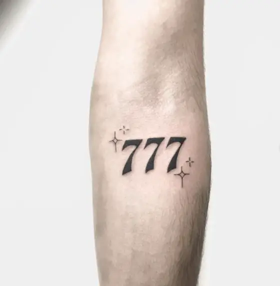 Black Stars and 777 Arm Tattoo