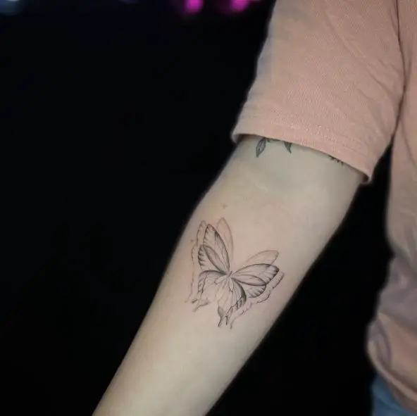 Blur Butterfly Forearm Tattoo