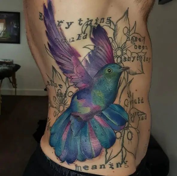 Big Colorful Hummingbird Tattoo on Ribs