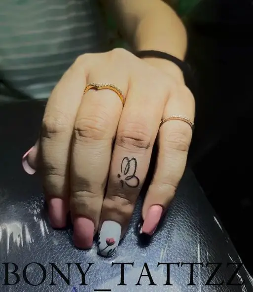 Minimalistic Semicolon Butterfly Finger Tattoo