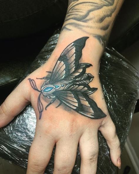 Grey and Blue Hand Moth Tattoo