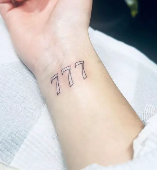 Black and White Angel Number 777 Wrist Tattoo