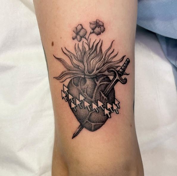 Small Flowers on Stabbed Sacred Heart Arm Tattoo