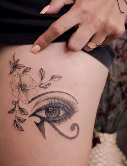 Grey Flower Eye of Horus Thigh Tattoo