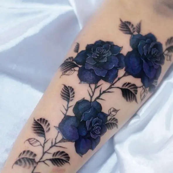 Dark Blue Roses with Leaves and Thornes Arm Tattoo