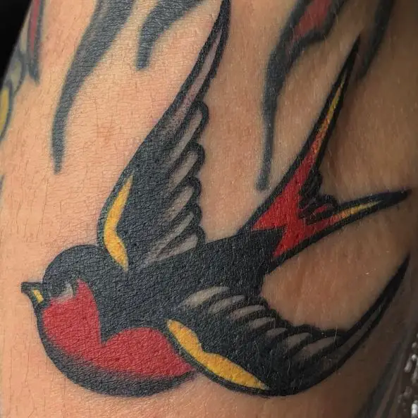 Flying Black and Red Swallow Tattoo