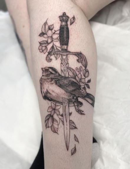 Dagger Stabbed in Sparrow Leg Tattoo