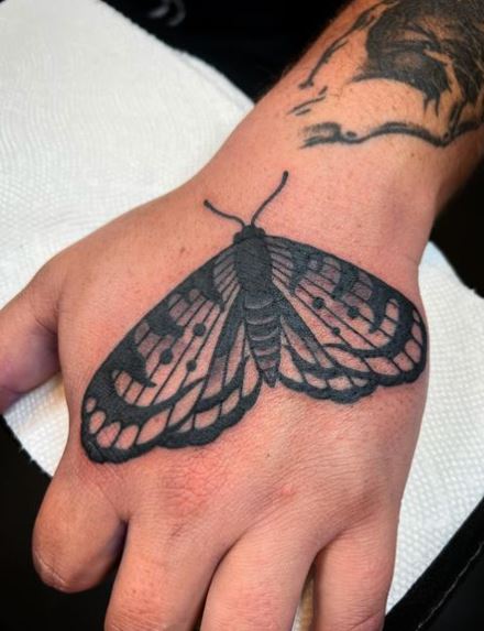 Grey Moth Hand Tattoo