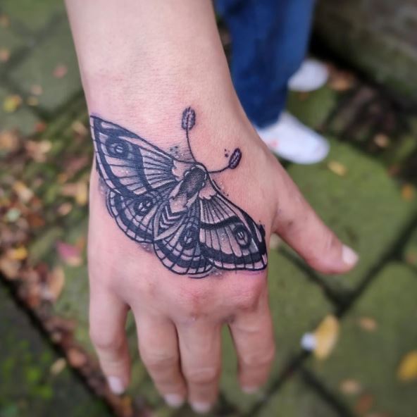 Grey Realistic Moth Hand Tattoo