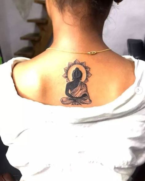 Sun and Buddha Spine Tattoo