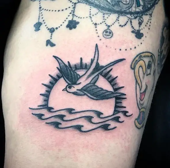 Flying Sparrow over Sea Leg Tattoo
