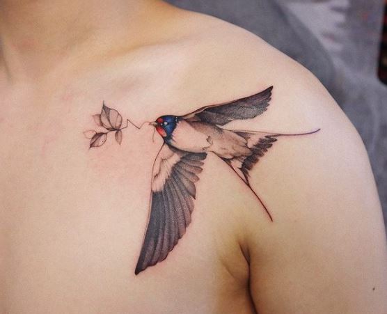 Colored Swallow with Branch in Beak Shoulder Tattoo