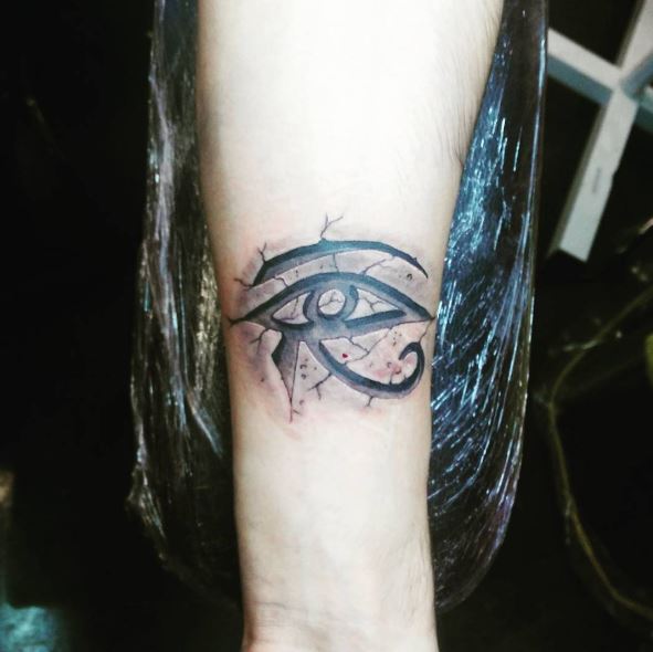 Cracked Background Eye of Horus Tattoo