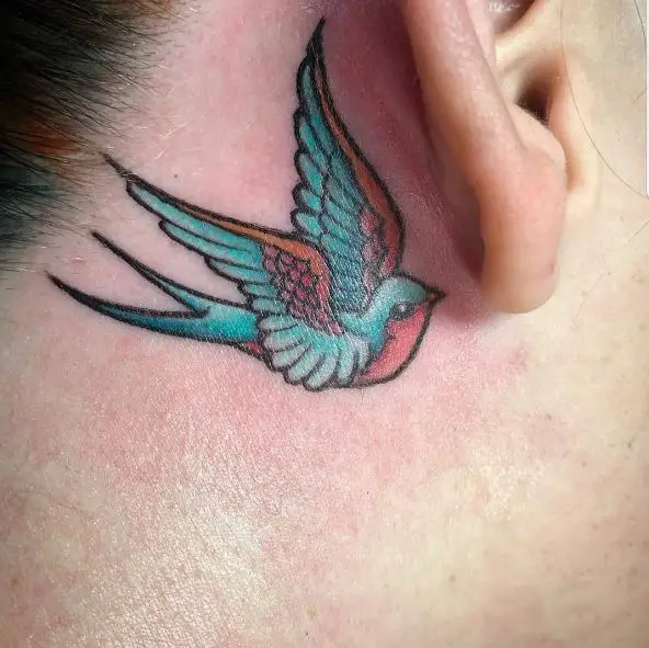 Small Colorful Behind Ear Tattoo