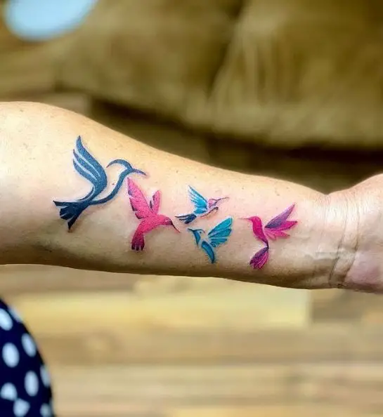 Colorful Forearm Flock Of Hummingbirds Tattoo