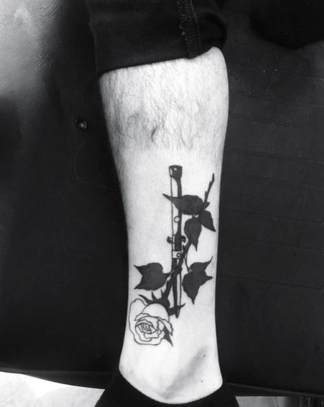 White Upside-down Rose with Black Leaves Tattoo