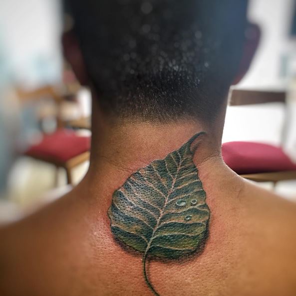 Realistic Bodhi Leaf Upper Back Tattoo