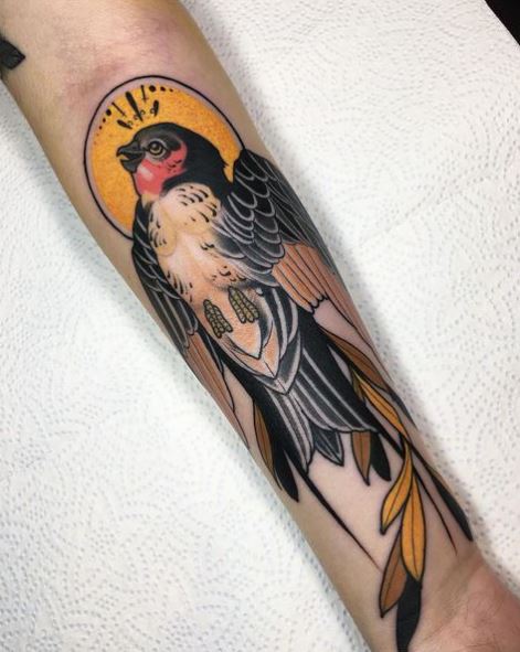 Realistic Colored Swallow with Halo Forearm Tattoo