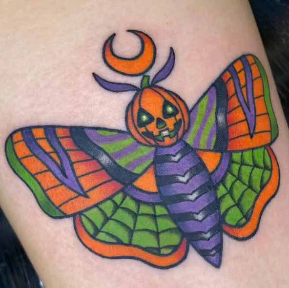 Colorful Halloween Moth Thigh Tattoo