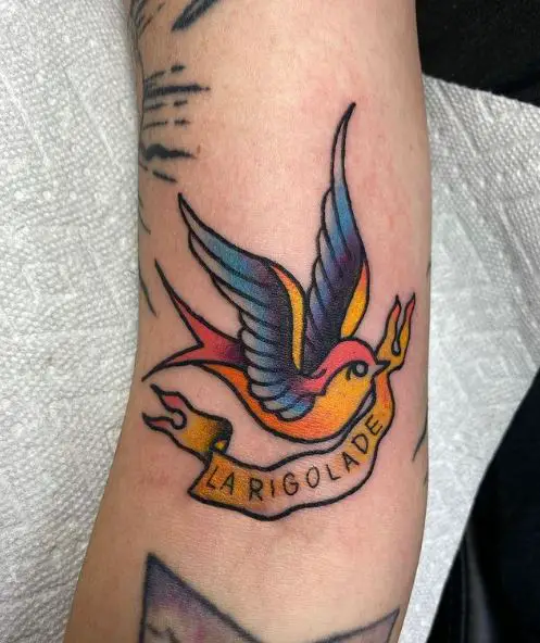 Colorful Swallow with Banner in Beak Tattoo