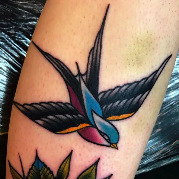 Colorful Swallow Flying over Flower Tattoo