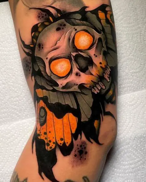 Fiery Eyes Skull and Moth Thigh Tattoo