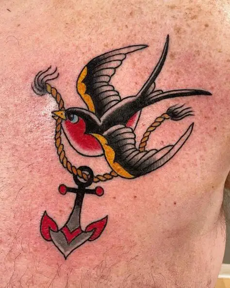 Colored Swallow Carrying Anchor on Rope in Beak Tattoo