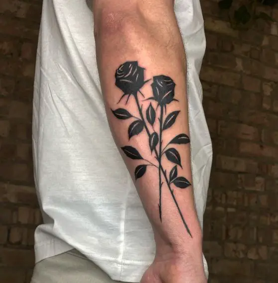 Two Crossed Black Roses Arm Tattoo