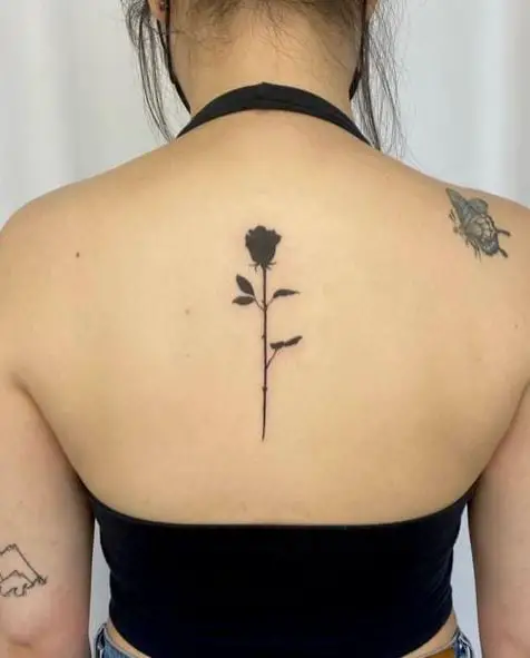 Thin Black Rose Spine Tattoo