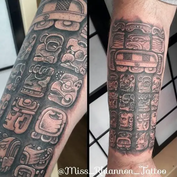 Grey Shaded Mayan Carvings Forearm Tattoo