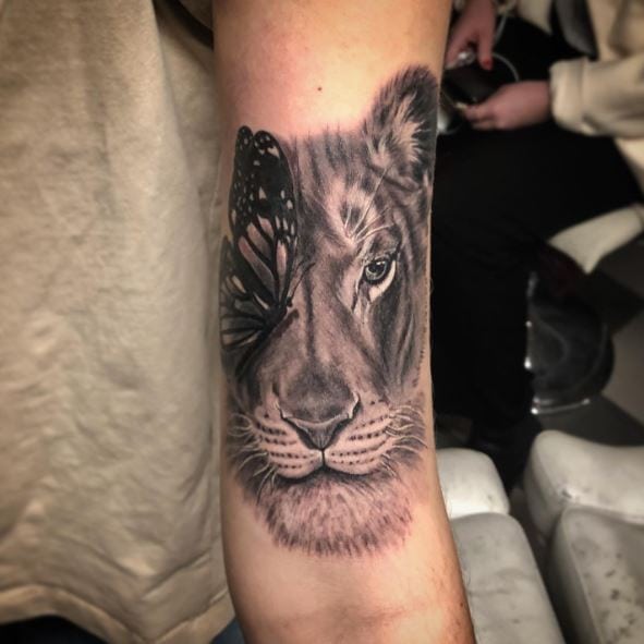 Lioness and Butterfly Biceps Tattoo