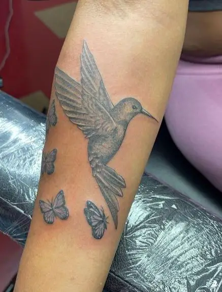 Hummingbird and Butterflies Tattoo on Forearm