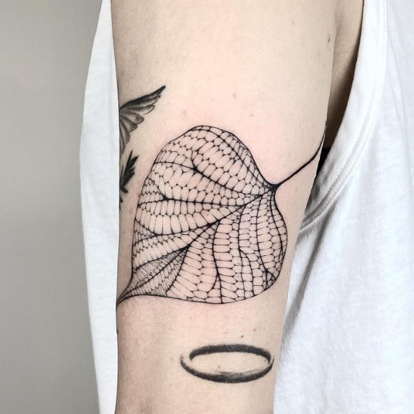 Black Bodhi Leaf Arm Tattoo