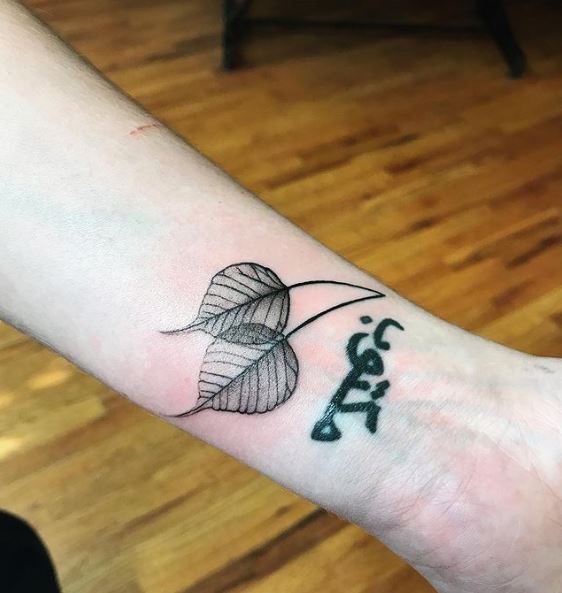 Arabic Letters and Bodhi Leaves wrist Tattoo